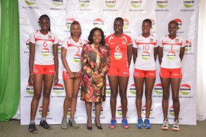 Ms. MaryJane Mwangi CEO, National Oil with Malkia Strikers players wearing the NOC branded uniform